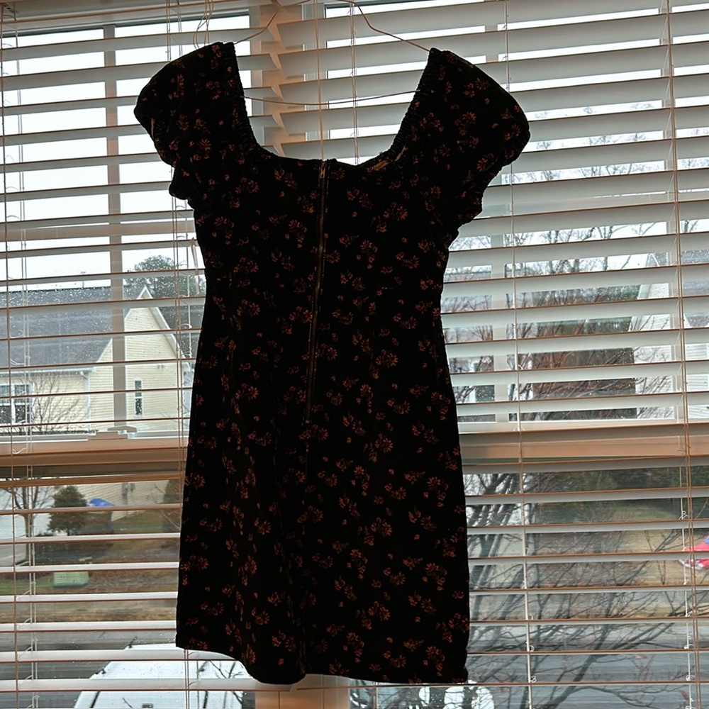 Corduroy fabric, black with pink flowers, short sleeve, zipper down the front